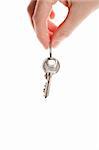 Hand and key isolated on white background