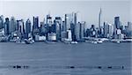 Toned image of Manhattan skyline viewed from New Jersey.