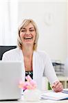 Portrait of smiling senior business woman at office