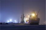 Container ship loading, sea port Dudinka, Russian Federation, December