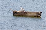 A Grey Heron (Ardea cinerea) sitting on an old boat in lake Kerkini, northern Greece