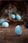 Easter decoration background with blue eggs on wooden background