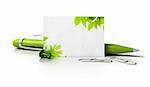 blank business card with leaves at the corner, ballpoint pen thumbtack and paperclips over a white background with reflection