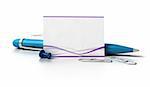 blank business card with purple waves at the bottom, green ballpoint pen, thumbtack and paperclips over a white background with reflection