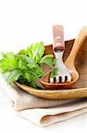 wooden plate and cutlery on a white background