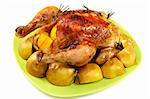 Chicken stuffed with lemons, apples and rosemary on white background.