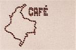 Coffee beans on canvas in the shape of the map of Colombia and the word Cafe