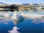 Icerbeg melting in a depp blue iceland sea