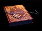Christian book of prayers and  gold amulet