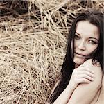 portrait of a girl next to haystack