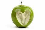 Green apple with a bite with a shape of a heart