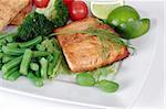 fried salmon with vegetables   on white background