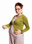 Pregnant woman shows her belly. Studio photo of pregnant woman isolated on white.