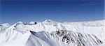 Panorama of winter mountains. Caucasus Mountains, Georgia, view from ski resort Gudauri.