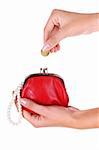 Red wallet and coin in womans hand. Isolated at white