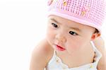 Adorable pan asian baby girl on white background