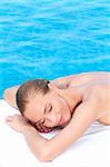 Woman during spa treatment next to swimming pool