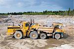 Excavation and dump vehicle in a granite quarry