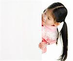 Little pan asian girl looking at white blank card