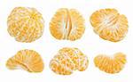 Slices of tangerine fruit isolated on white background