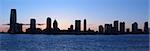 buildings silhouettes of Jersey City. Photo taken from Manhattan across Hudson River