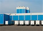 modern blue warehouse with loading docks