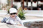 adorable caucasian toddler enjoying his tropical vacation