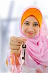 Muslim woman holding a new key