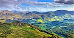 Beautiful panorama of the peaks, plateaus and valleys in Auvergne (Cantal) in The Central Massif located in south-central France.This region contains the largest concentration of extinct volcanoes in the world.