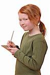 Young girl writes in a notebook on white background