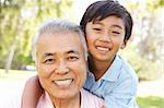 Grandfather With Grandson In Park