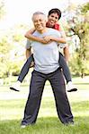 Senior Couple Working Out In Park