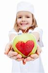 Little girl dressed as nurse giving you an apple with heart - healthy life concept