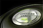 abstract success start button, metal material, green color and black textured background. Focus on the main word and blur effect. successful concept