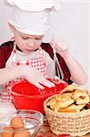 little boy in chef's hats on grey background