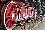 Close up shot of wheels of the old locomotive
