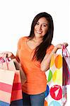 Beautiful Happy smiling young woman on shopping spree carrying colorful bags with merchandise presents celebrating, isolated.