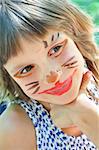 happy smiling child with funny painted face