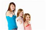 Three Girls Giving Thumbs Up Gesture In Studio