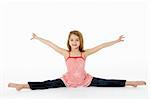 Young Girl In Gymnastic Pose Doing Splits