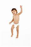 Studio Portrait Of Baby Boy Standing