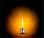 wax candle into lighting bulb, light bulb conceptual Image.