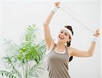 Portrait of happy fitness woman with towel