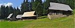 historic rural wooden houses panorama, photo taken in an open-air museum in Vychylovka, Slovakia.