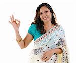 Beautiful Indian woman showing okay hand sign on white background