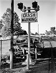 1960s 1950s CAR CRASHED HEAD-ON INTO CRASH WARNING SIGN POLE SYMBOLIC OUTDOOR