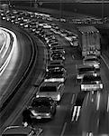 1960s NIGHT VIEW OF HIGHWAY ROAD AT NIGHT CROWDED BLURRED ACTION OUTDOOR