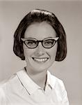 1960s SMILING PORTRAIT WOMAN WEARING HORN-RIMMED GLASSES LOOKING AT CAMERA