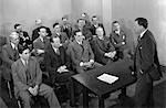 1930s 1940s 1950s MEETING OF A GROUP OF BUSINESSMEN SALESMEN IN A CLASSROOM FOR A SALES TRAINING LECTURE