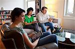 Friends relaxing together in living room